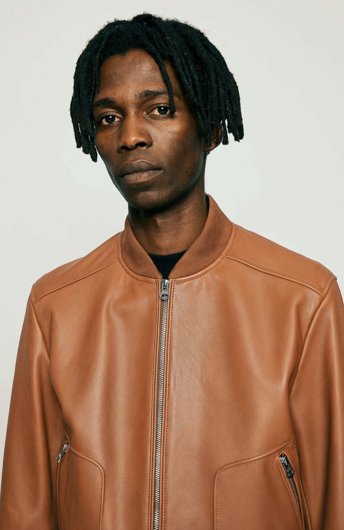 Men's Tan Brown Leather Bomber Jacket Front Closeup - Timeless Style